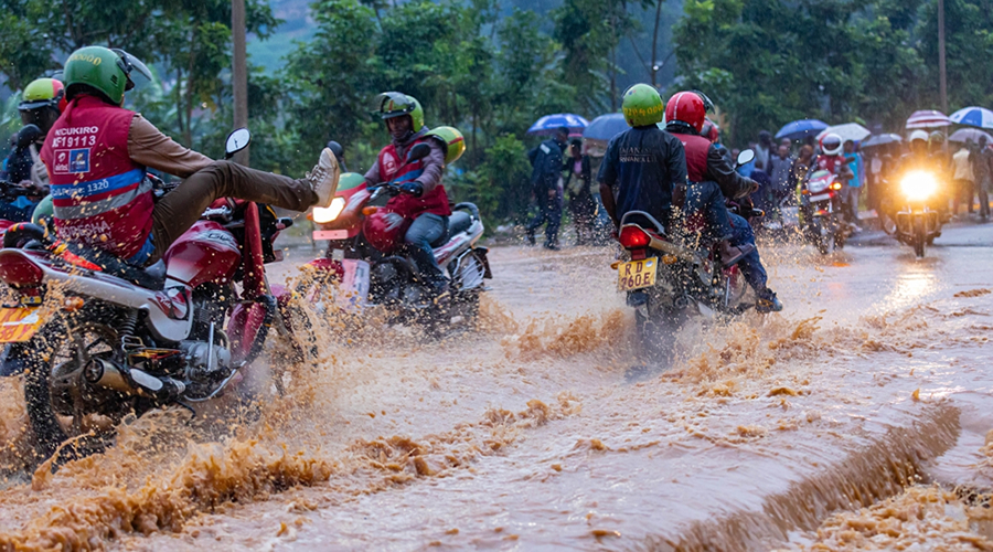 Passenger service riders paddle through a flooded street in the city of Kigali, Rwanda. Source: Blogs.World Bank